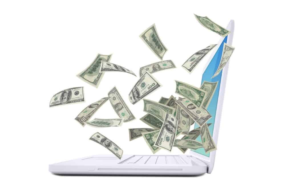 Laptop and Cash guide to affiliate marketing