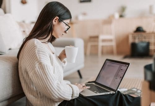 Image of woman using her virtual assistant skills to make money online on her laptop