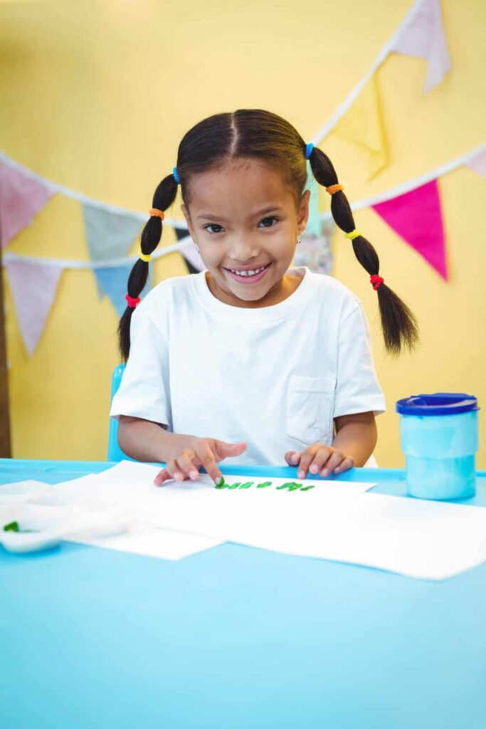 little girl finger painting