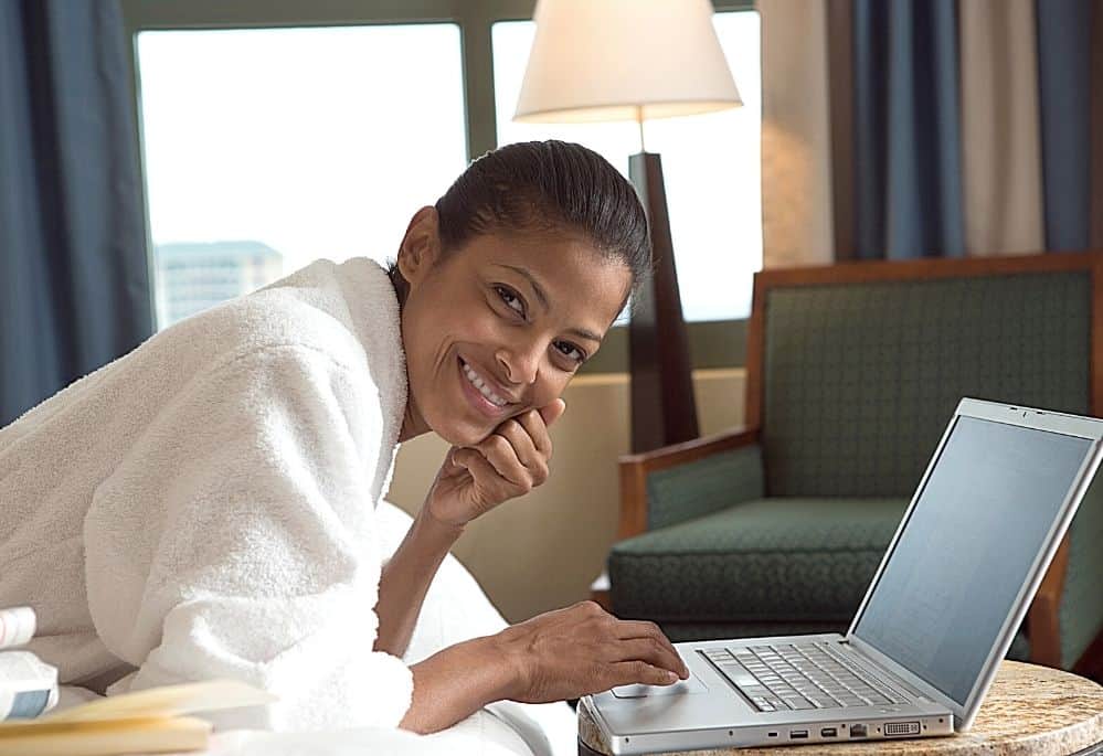 Woman on Laptop doing her hotel mystery shopper job