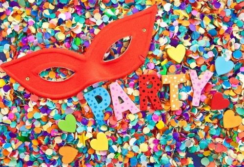 Image of party sign and decorations with masquarade party mask for party printables business